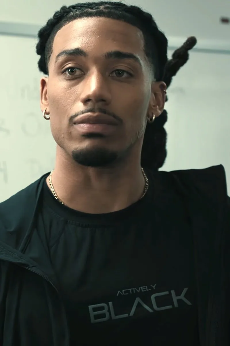 Shaquille in an Actively Black performance shirt